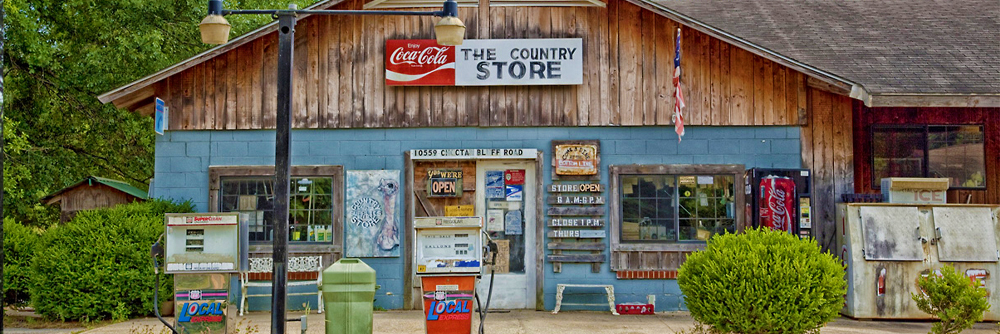display of calendars featuring barns, rural settings, animals, farm animals and always, cowboys